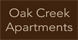 Oak Creek Apartments logo