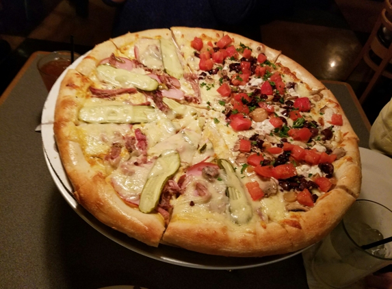 Dewey's Pizza - Kirkwood, MO. Large pizza is one half "Cuban" & one half "Edgar Allen Poe". 
Very delicious!  ����