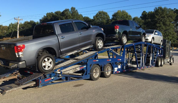 IDA Service & Transport - Hoschton, GA. Transporter loading up cars repaired and reconditioned for a dealer.