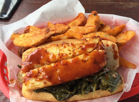 Delia's Chicken & Sausage Stand - Atlanta, GA. Smack and Cheese slinger! Yummy collards