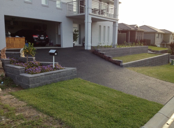 Dezigna Retaining Walls - Marks Point, NSW. Steel Reinforced, Concrete Core Filled Split Faced Retaining Walls