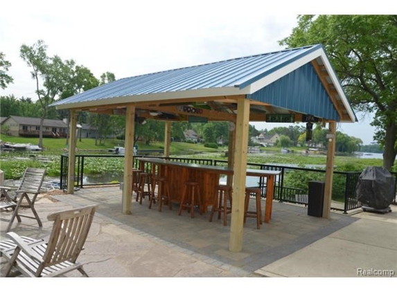 Botanical Designs and Landscaping Inc. - Lake Orion, MI. 20 person bar with TV / Fans roof