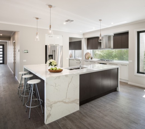 Granite Transformations of Little Rock - North Little Rock, AR. Quartz Statuario Marble Counter Top with Waterfall Edge makes this Modern European-Inspired Kitchen pop!