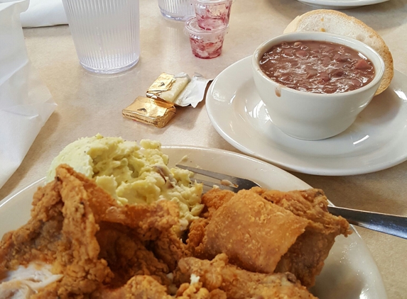Mother's Restaurant - New Orleans, LA. 1/2 fried chicken w potato salad & red beans/rice.  30 min wait time but well worth it.