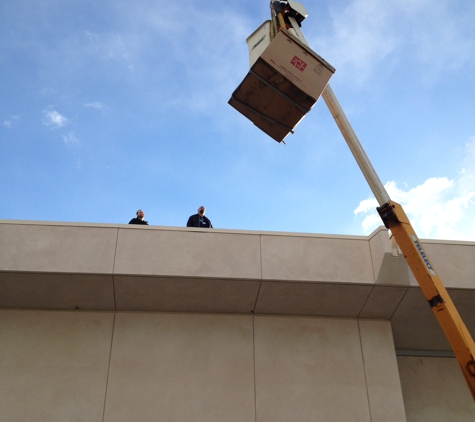 Redline Fire Protection - Cathedral City, CA. Lifting of new exhaust fan