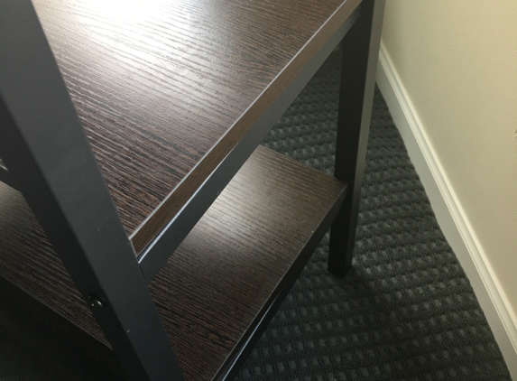 Furniture Land - Columbus, OH. The delivery guy is rude. He fixed my table like this . I talk to the manager on showroom but they don't do anything