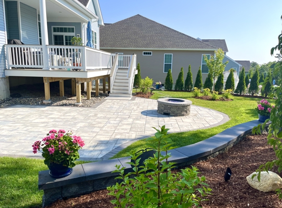 Dellarocco's Landscaping Inc - Middleboro, MA. Patio, firepit & sitting wall installed at Pine Hills in Plymouth, MA.