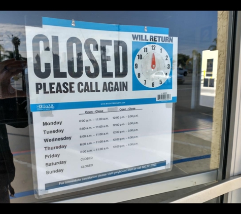 Greyhound Bus Lines - San Fernando, CA. Hours sign.