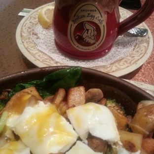 Another Broken Egg Cafe - Burbank, CA. Potato Sensation with spinach, broccoli, mushrooms, poached eggs and cheddar cheese on top!