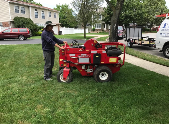 Ken's Sprinkler Service and Repair Corp. - Carle Place, NY. Pipe puller for sprinkler installation that does not disturb the lawn.