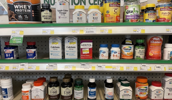 Quality Care Pharmacy - Baltimore, MD. Assorted vitamins and OTC products