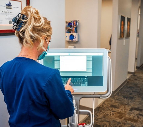 Family Dental Choice - Charlotte, NC. Dental hygienist using iTero for dental bridges procedure at Family Dental Choice Charlotte NC