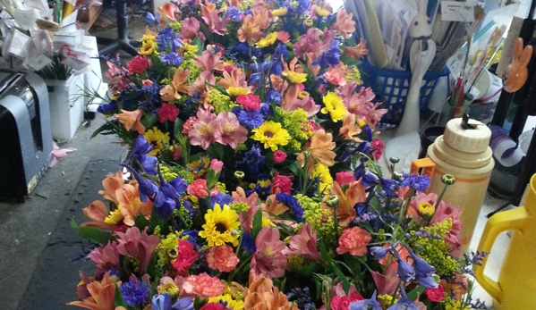 Colonial Flower Shop - New Paltz, NY. Centerpieces for a wedding ready to load into the delivery van.