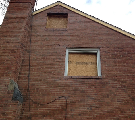 HERE COMES KOVACH Restoration - Richfield, OH. Complete side of brick house uniform clean of fire/ smoke damage