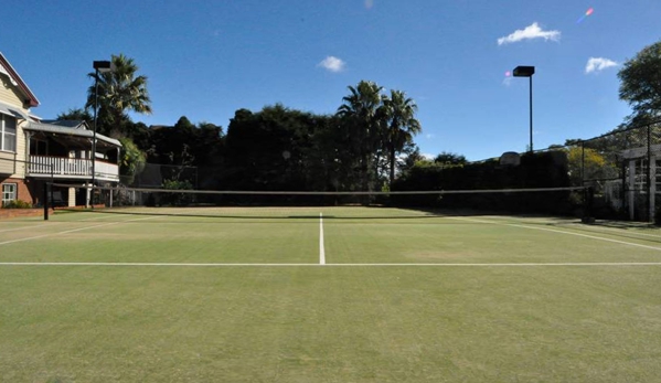 Sports Construction Group - Brendale, QLD. Synthetic Grass court on concrete base completed 20 years ago - Toowoomba