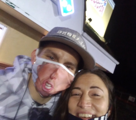 Domino's Pizza - Tacoma, WA. Carri n Chris in front of the dominoes sign...