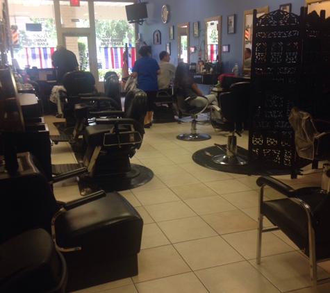 Rosetta's Barbershop & Salon - boynton beach, FL. View looking from rear of shop. Clean professional.  Great place to work. This was at the end of the day so time to say good night to Rosett