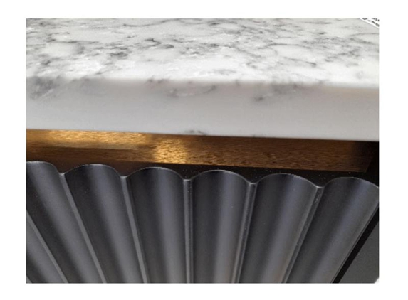ROXTELL Kitchen Renovations Sydney - Chipping Norton, NSW. Vanity details; Monte Bianco Caesar Stone, brushed stainless steel rail and black matt fluted doors