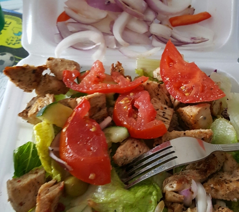 Medo's Italian Restaurant - Asheboro, NC. I order from medos all of the time, today I was disappointed with my grill chicken salad, as you can see a whole onion and old tomatoes.....