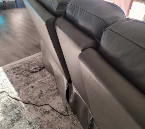 Exclusive Furniture - Houston, TX. Cord running because you have to cut the couch open to get to the battery