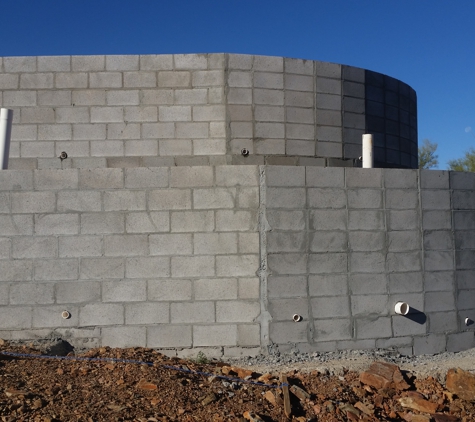 Building Block Masonry - Phoenix, AZ. 10 ft tall retaining retaining walls with a planter in between the walls