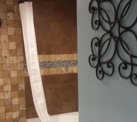 Iola's Home Away Extended Stay - DeRidder, LA. Custom Tile Bathroom