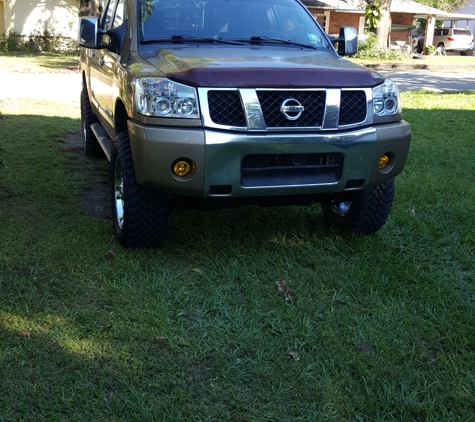 Extreme Customs - Oshkosh, WI. To Ryan this is my 2005 Nissan titan with a 6inch left