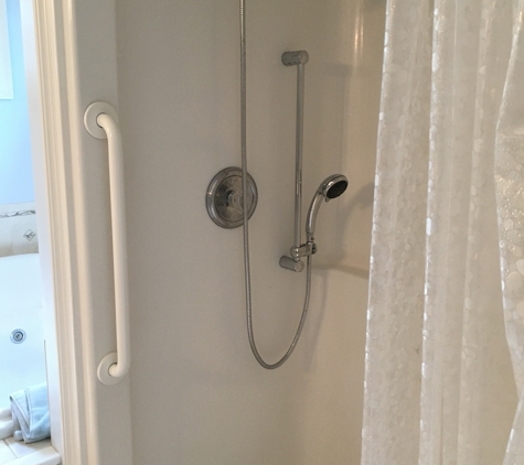 Oakley Services, Home Modification Division - Narragansett, RI. Mobile Shower head with Slide Bar and Grab Bars for ultimate shower safety