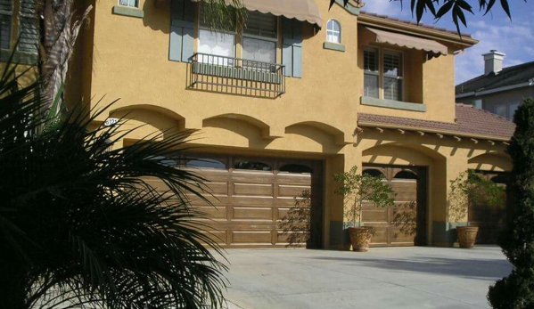 Sparkle Restoration Decorative Concrete Resurfacing - Corona, CA. Wood faux finish on garage doors.