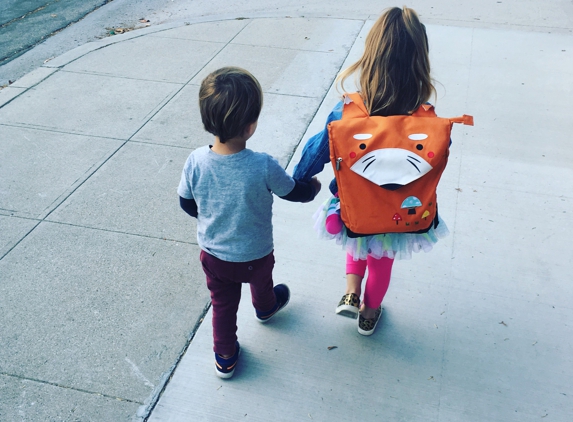 Village Church Preschool - Burbank, CA. Big sis and little bro walking into school together.