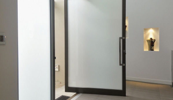 Bradnam's Windows & Doors - Urraween, QLD. Black Aluminium Pivot Door With Obscure Glass