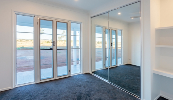 Bradnam's Windows & Doors - Mount St John, QLD. Mirror Sliding Wardrobe Door