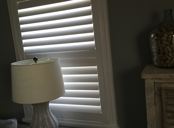 More Than Blinds - Mentor, OH. Norman Woodlore Plus 3 1/2" Shutters with Divider Rail, Decorative Frame, & Hidden Tilt Bar.