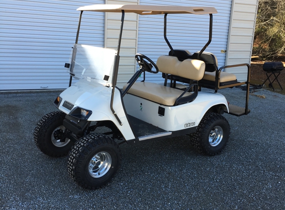 HAPPY'S CUSTOM GOLF CARTS - Kingston, GA. E-Z-GO TXT GOLF CARTS **LIFTED** 4 SEATERS     only $4600.00
48 VOLT
NEW REAR FLIP SEAT **CONVERTS TO UTILITY BED**
NEW HEAD AND TAIL LIGHTS