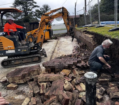 Sydney Mini Bobcat Hire - Glenorie, NSW. Demolishing failed retaining wall