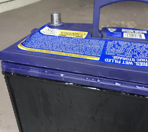 Harry's Auto Care - Belconnen, ACT. top of casing damage marks and battery acid leaking out