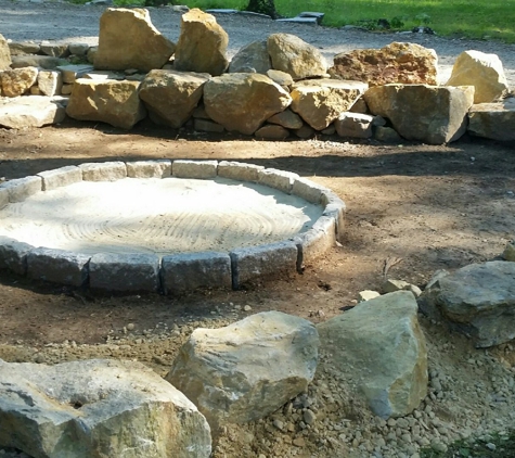 Premier Landscaping - Stafford Springs, CT. Natural stone fire pit area by Premier Landscaping of Stafford Springs, CT 06076. (860) 965-3779 facebook.com/PremierCTLandscaping