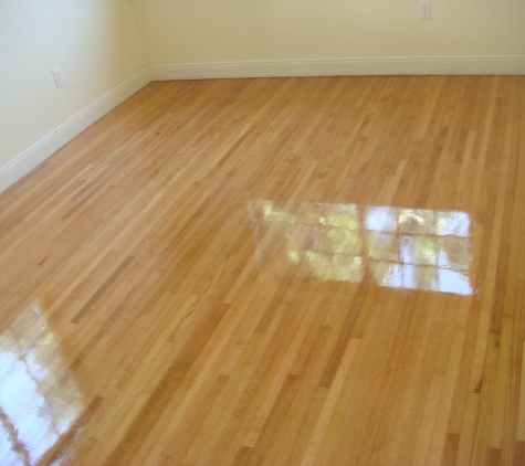 True Quality Wood Flooring - Fort Lauderdale, FL. Solid oak wood floors were refinished and coated with a natural polyurethane finish in Fort Lauderdale.