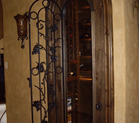 Wine Cellar Specialists - Dallas, TX. Door with wrought iron open to clean glass