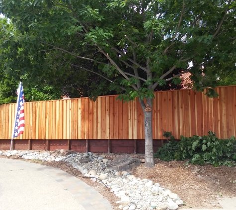 Family Fencing - Rio Linda, CA. Redwood Board on Board Privacy Fence with Retaining Wall