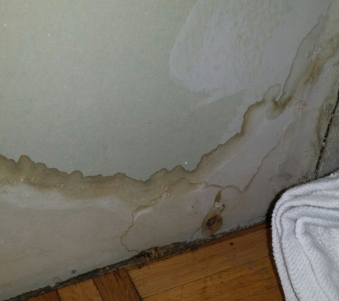 Classic A/C & Appliance Corp. - Woodside, NY. Water Damage to Wall after unit was not installed properly.