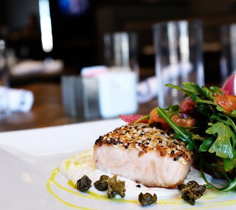 Soulshine Tavern & Kitchen - New Albany, OH. Everything Crusted Salmon, served with a lemon horseradish crème fraîche, petit arugula salad, pickled red onion, tomato, crispy capers, and