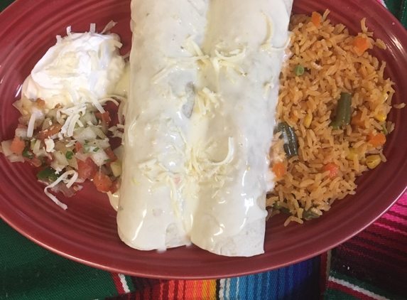 El Patron - Moundsville, WV. Burrito Grande ;grilled stk peppers,onions,tomatoes,rice,pico de gallo sour cream or guacamole / covered w/ chessee sauce on top.