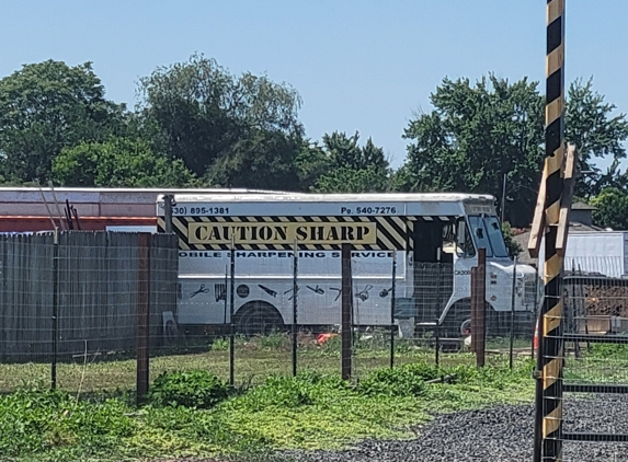 Caution Sharp - Chico, CA. Use second driveway at the caution stripe pole.