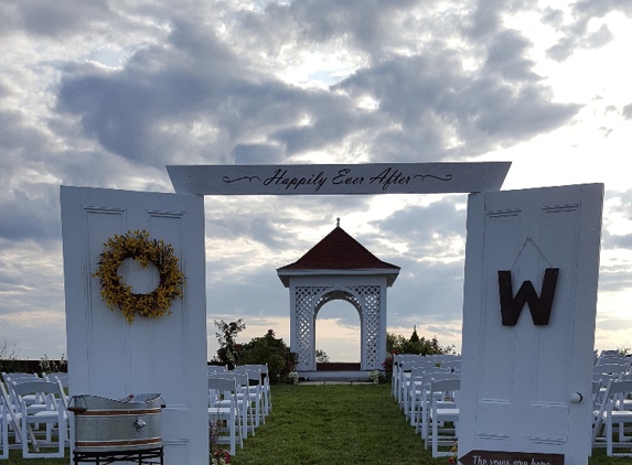 Maine Wedding Barn & Event Center at Farview Farm - Minot, ME. Wedding lawn grand entrance arch.