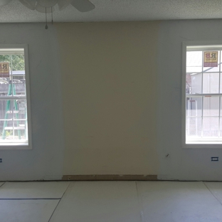 Cadiere Construction LLC - Houma, LA. Windows installed, moldings, electrical, sheetrock installed, and matching finish existing on walls