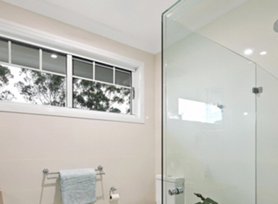 Bradnam's Windows & Doors - Gladstone Central, QLD. Frameless Shower Screen - Corner Configuration