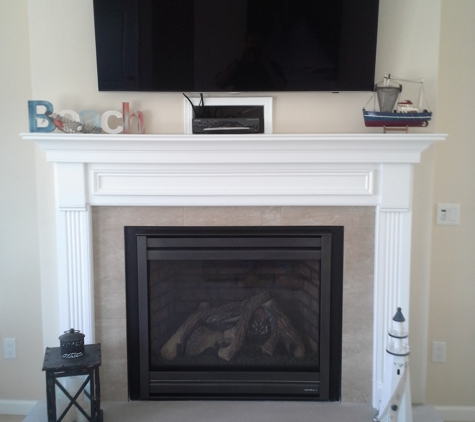 Kalinka Homes LLC - Toms River, NJ. Fireplace with mantle and raised hearth