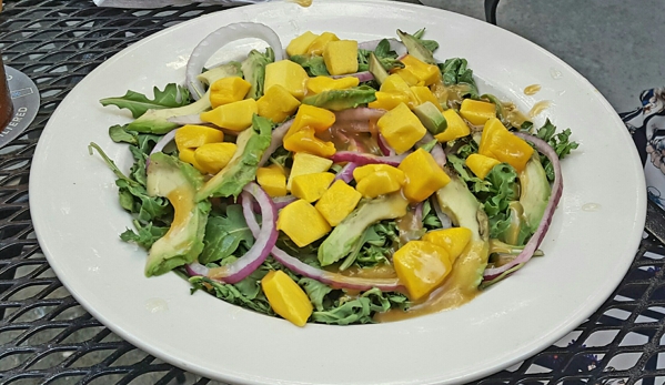 Hooligans - Alpharetta, GA. Mango, arugula, avocado salad with spicy(not spicy) orange, tangy dressing (delicious and light, yet filling).