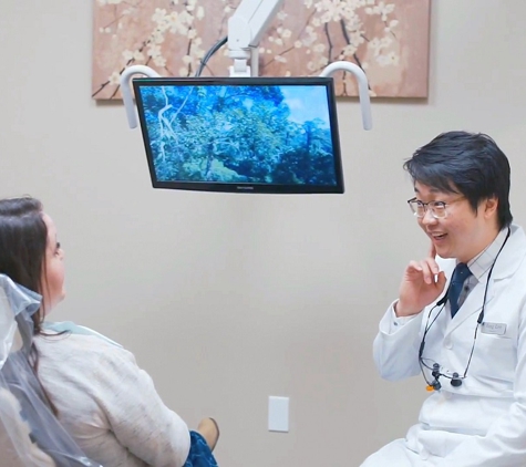 Pinewood Family Dental - Marysville, WA. Marysville dentist Dr. Jung Lee discussing dental implant case with team at Pinewood Family Dental